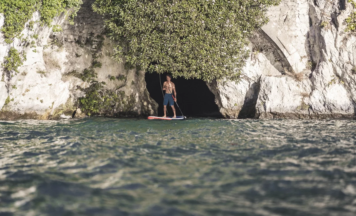 On SUP at the Ponale waterfall | © Archivio Garda Trentino (ph. Watchsome), Garda Trentino