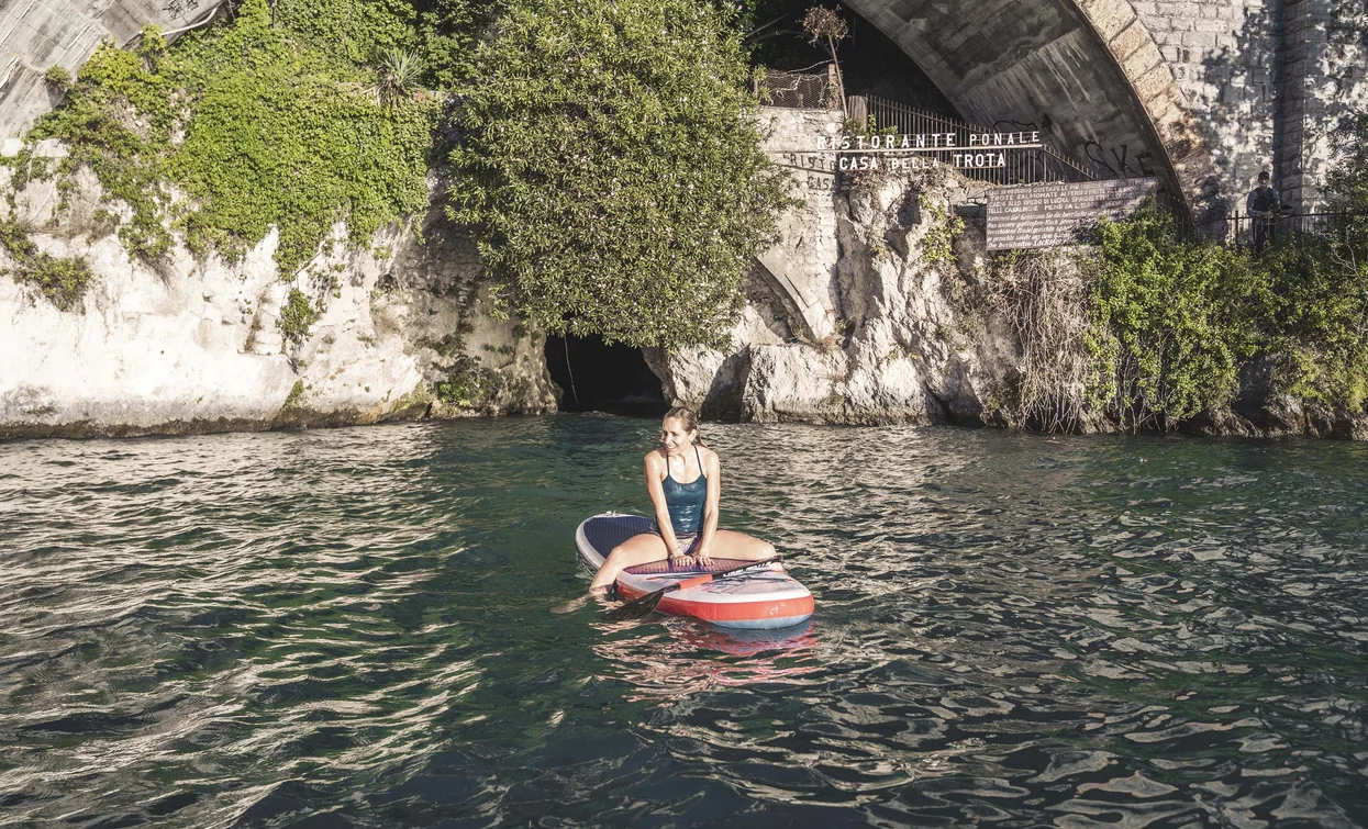 On SUP at the Ponale waterfall | © Archivio Garda Trentino (ph. Watchsome), Garda Trentino