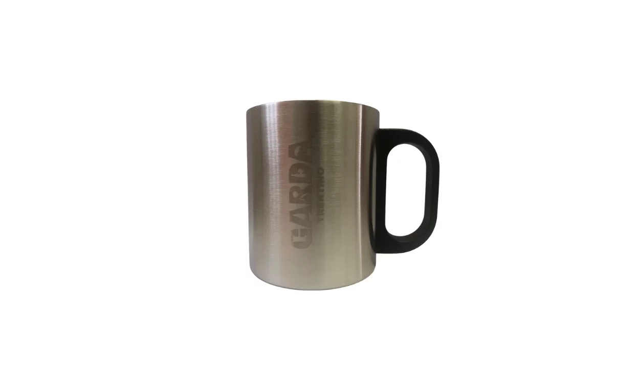 A stainless steel mug with a black handle. The name "GARDA" is engraved on the surface.