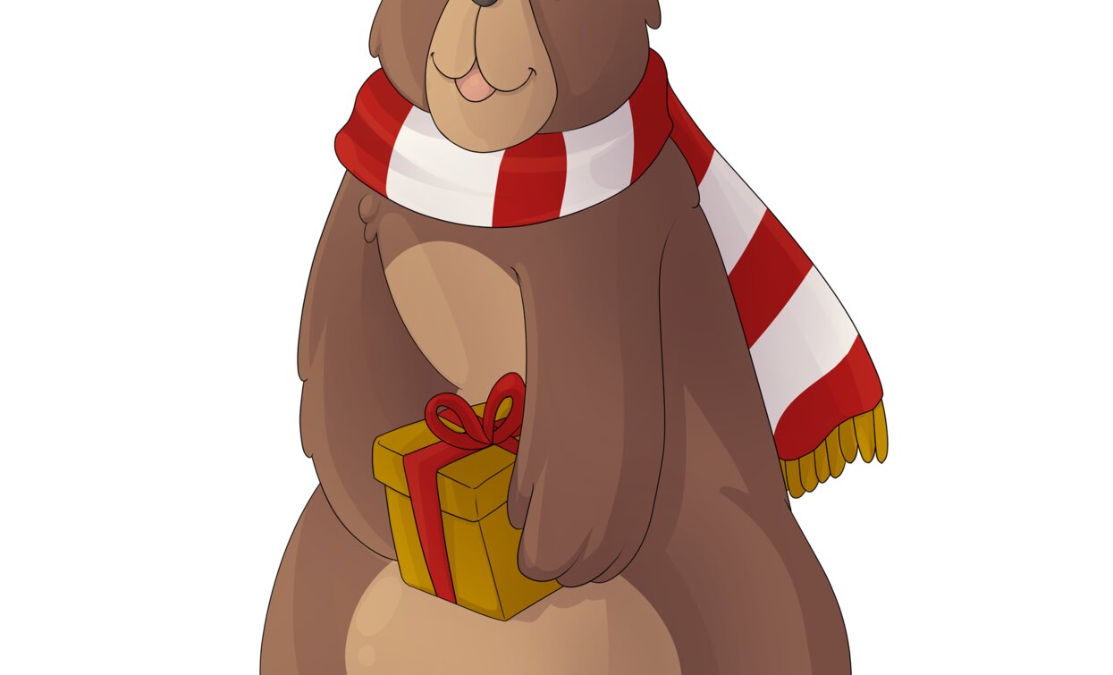A cute bear with a red and white striped scarf. It holds a gift with a red bow between its paws.