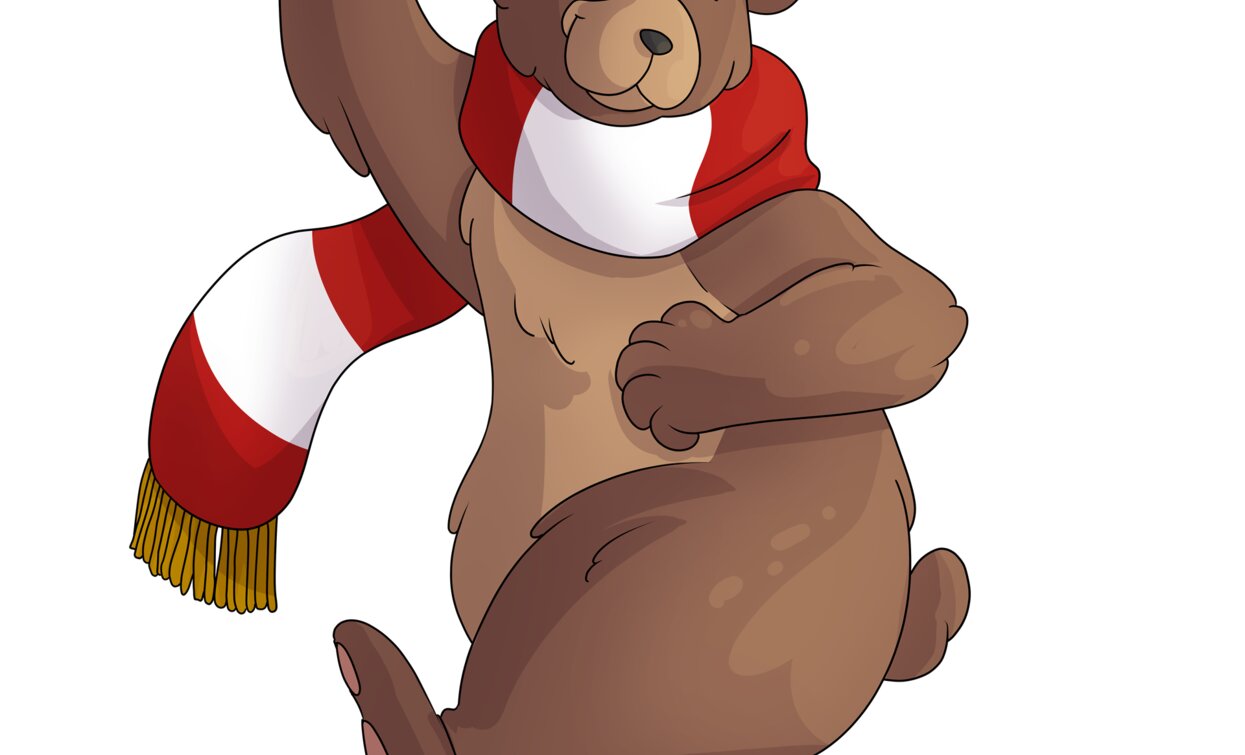 Un orso simpatico con una sciarpa rossa e bianca, che sta ballando. Ha un'espressione felice e vivace.