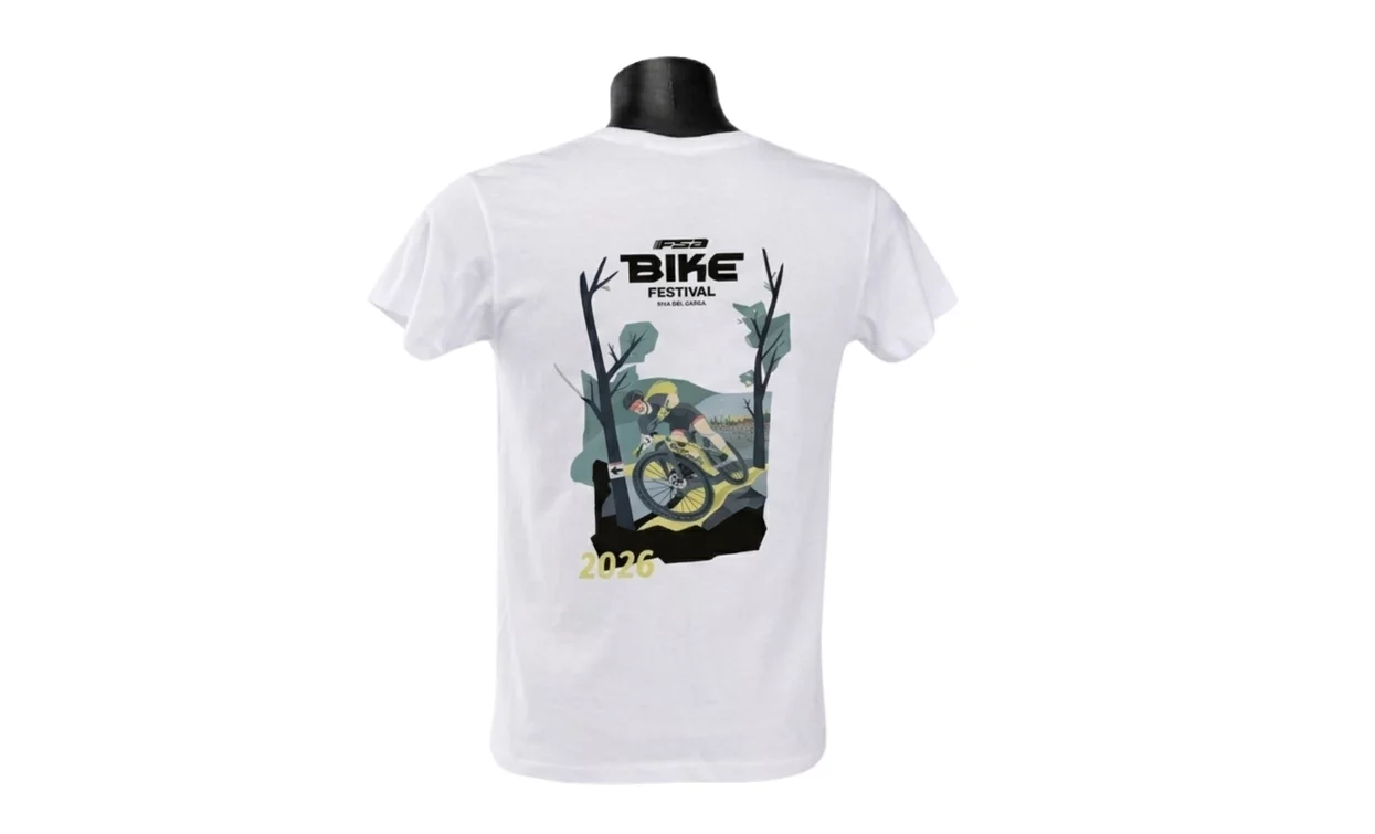 A white t-shirt with a design on the back that celebrates a bike festival. The design features a cyclist in a natural setting.